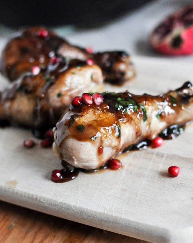 Chicken legs coated with sticky pomegranate sauce. 