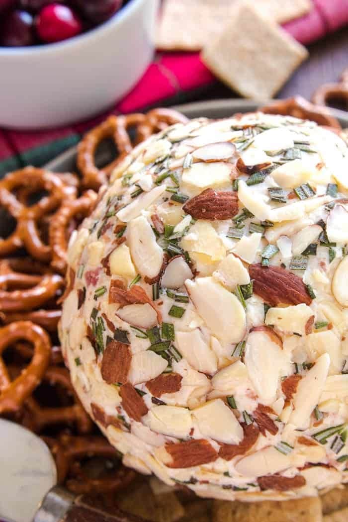 Sliced almond coated cheeseballs served with pretzels. 