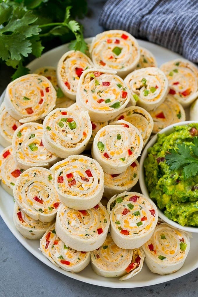 Taco Pinwheels with chicken, taco seasoning, cream cheese and peppers, all rolled up inside tortillas