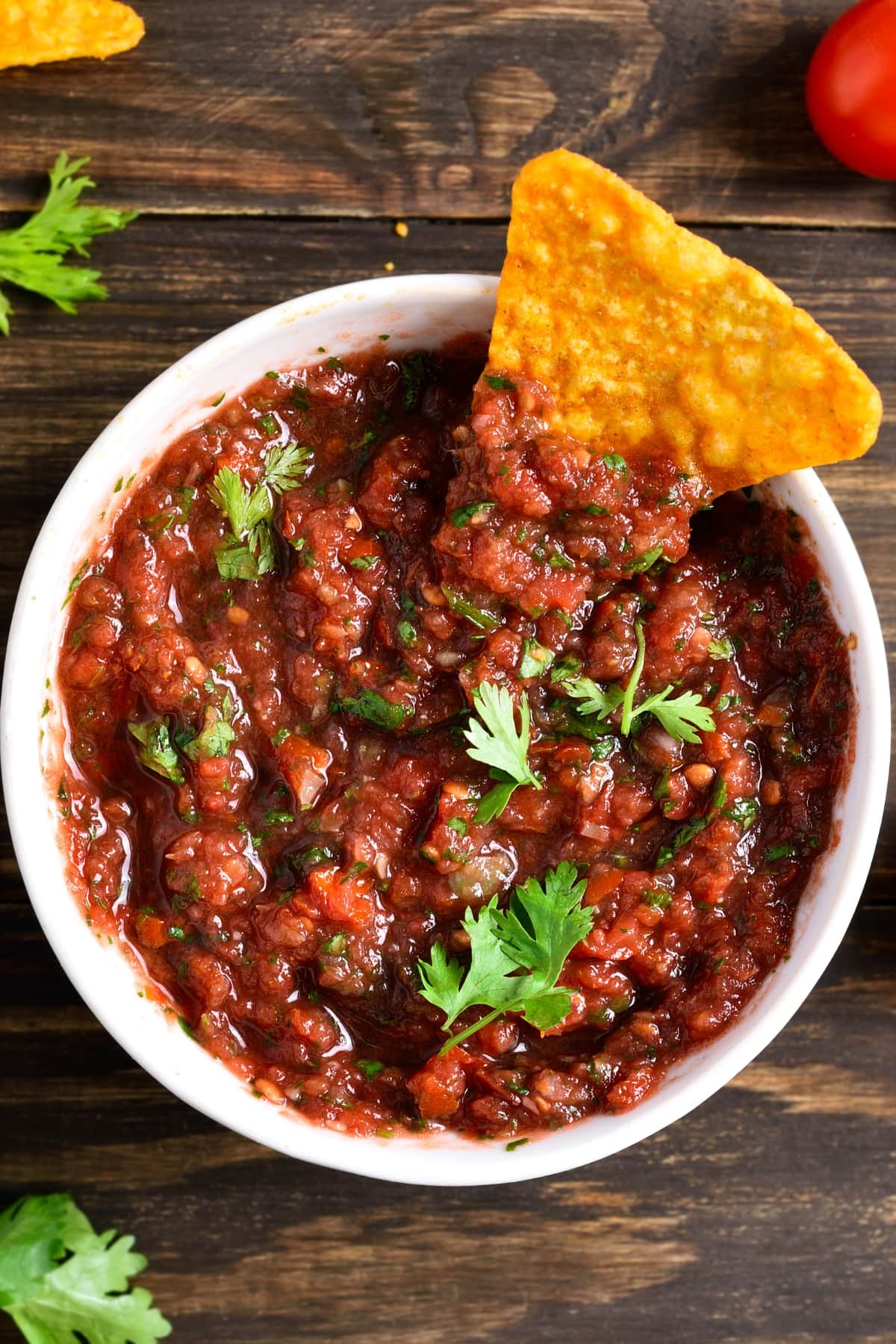 Bowl of homemade taco salsa with cilantro and chips