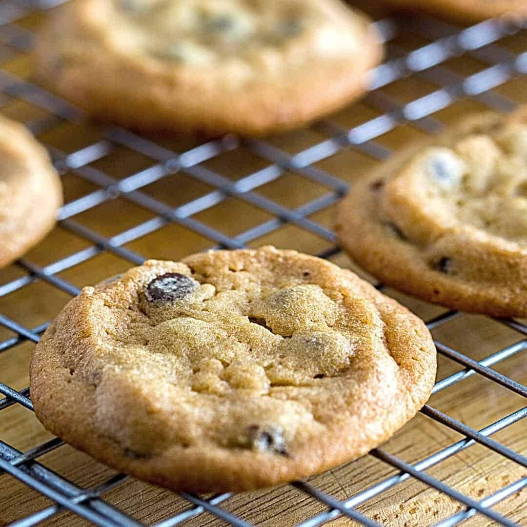 Chocolate chip cookies in a cooling rack.