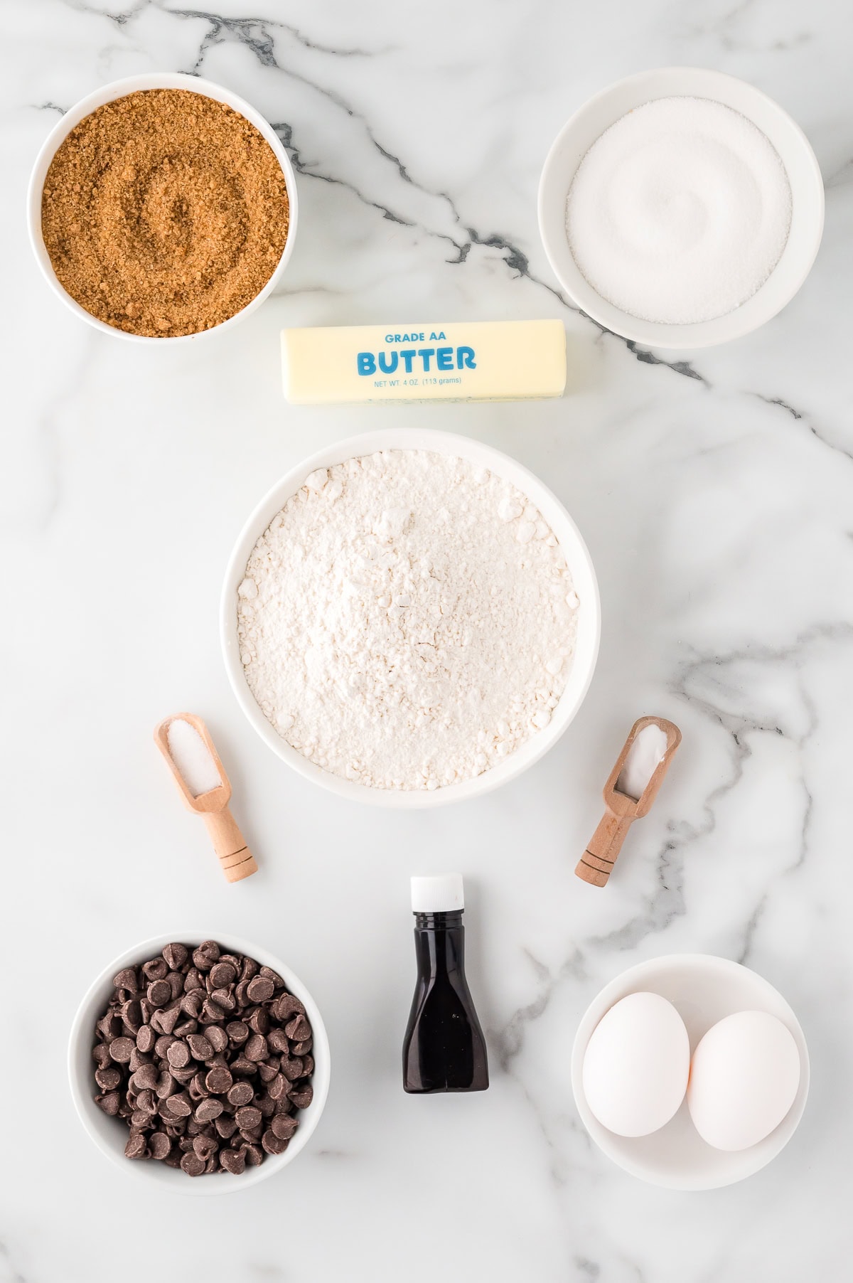 Ingredients for Toll House Chocolate Chip Cookies - flour, baking soda, salt, butter, sugar, vanilla, eggs, chocolate chips, nuts