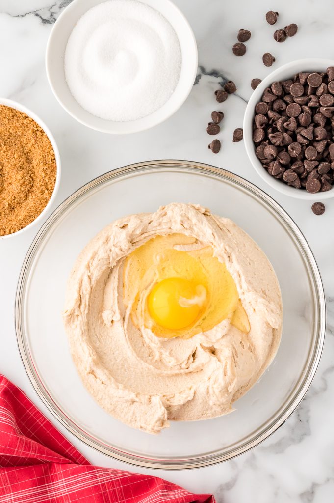 Creamed butter mixture with a raw egg on top.