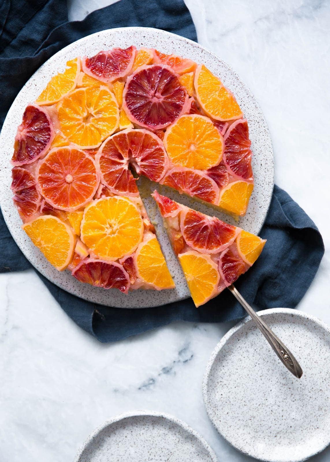 Upside down cake topped with blood oranges, navel oranges, and tangelos.