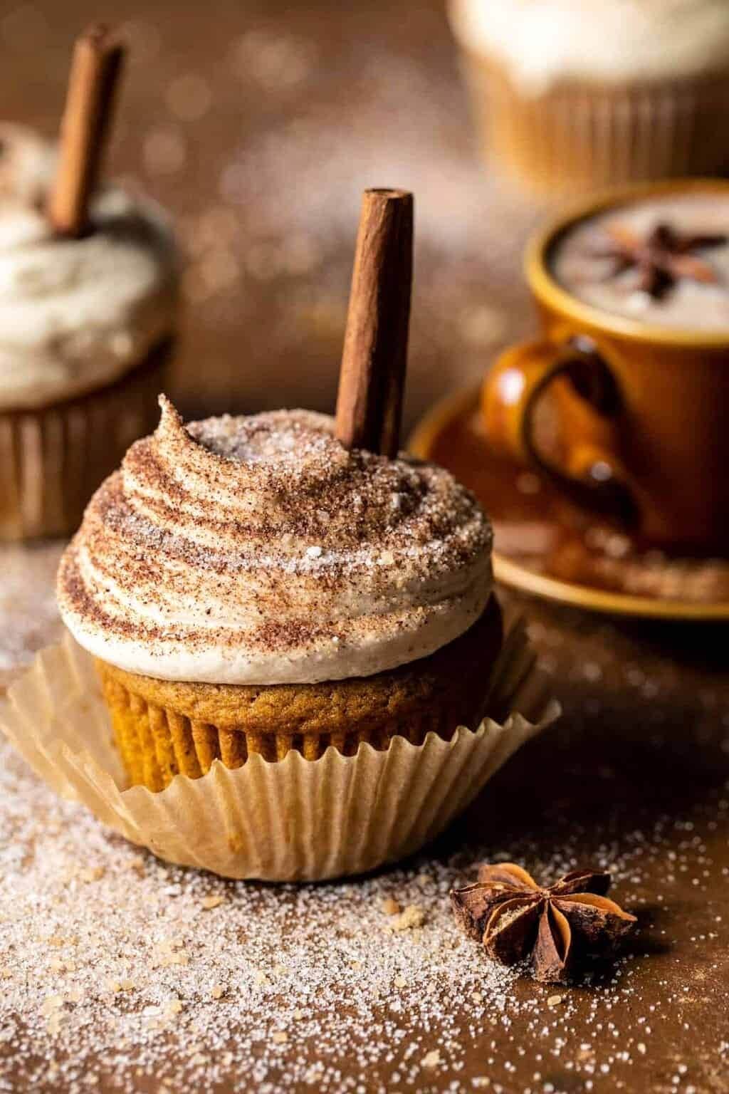 Pumpkin cupcakes topped with cinnamon brown sugar frosting, and finished off with a sprinkling of chai sugar. 