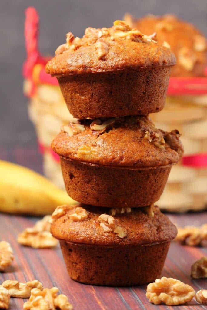 Stack of banana muffins with nuts.