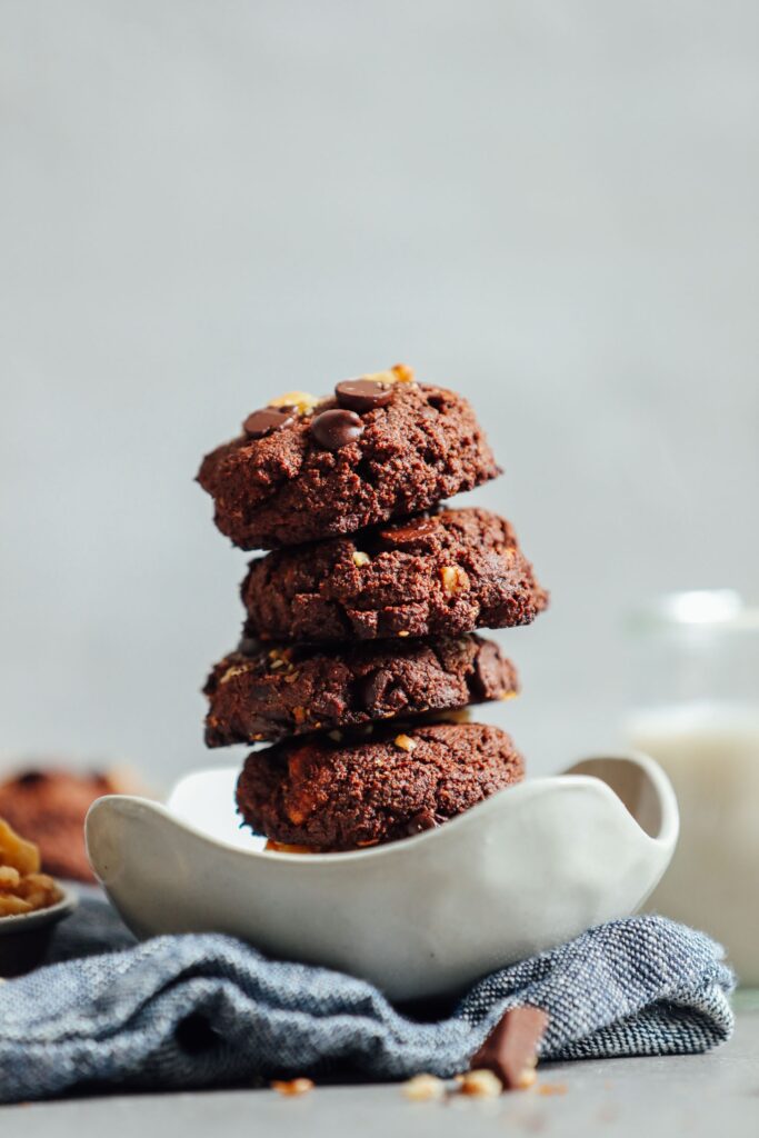 Stack of chunky brownie cookies with nuts and chocolate chips. 