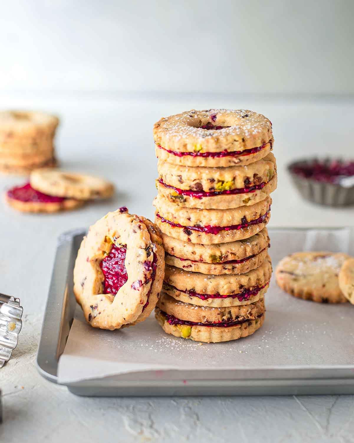 Stack of cookies with pistachio and cranberries filling.