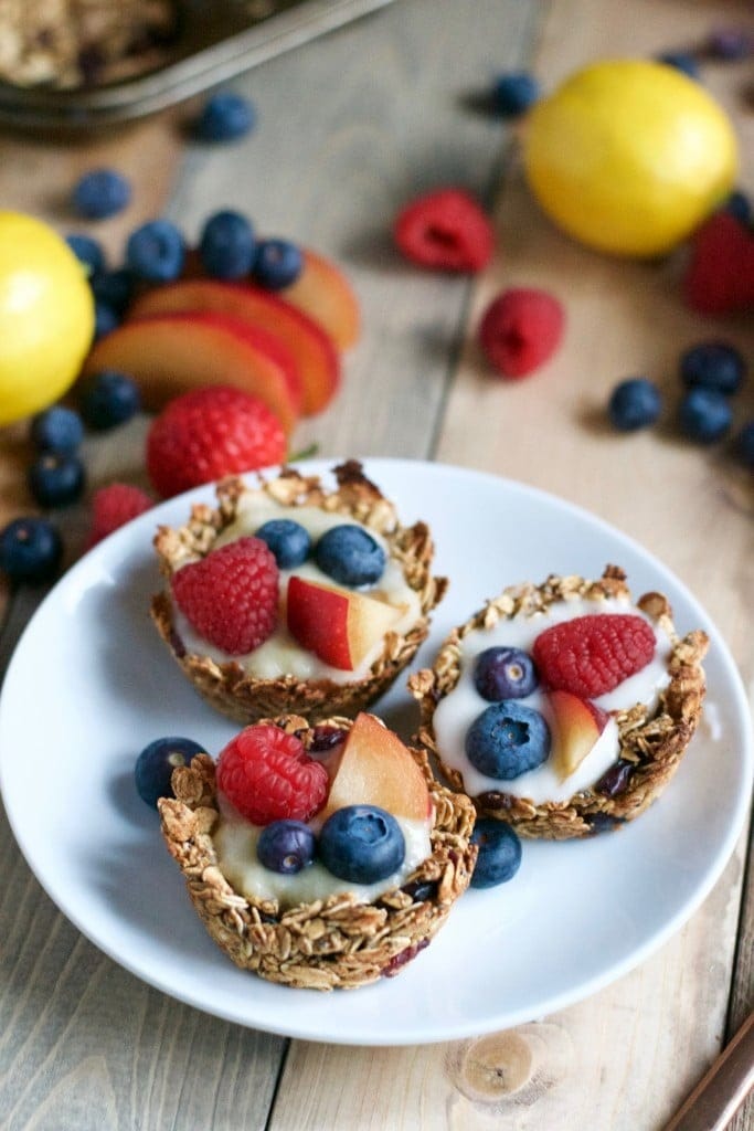 Granola cups with sliced apples and berries filling.
