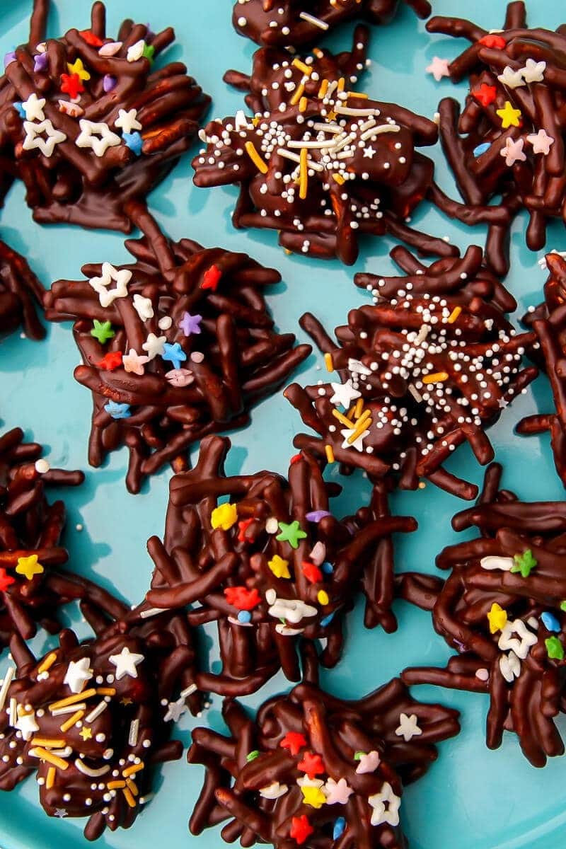 Chocolate haystack cookies garnished with sprinkles. 
