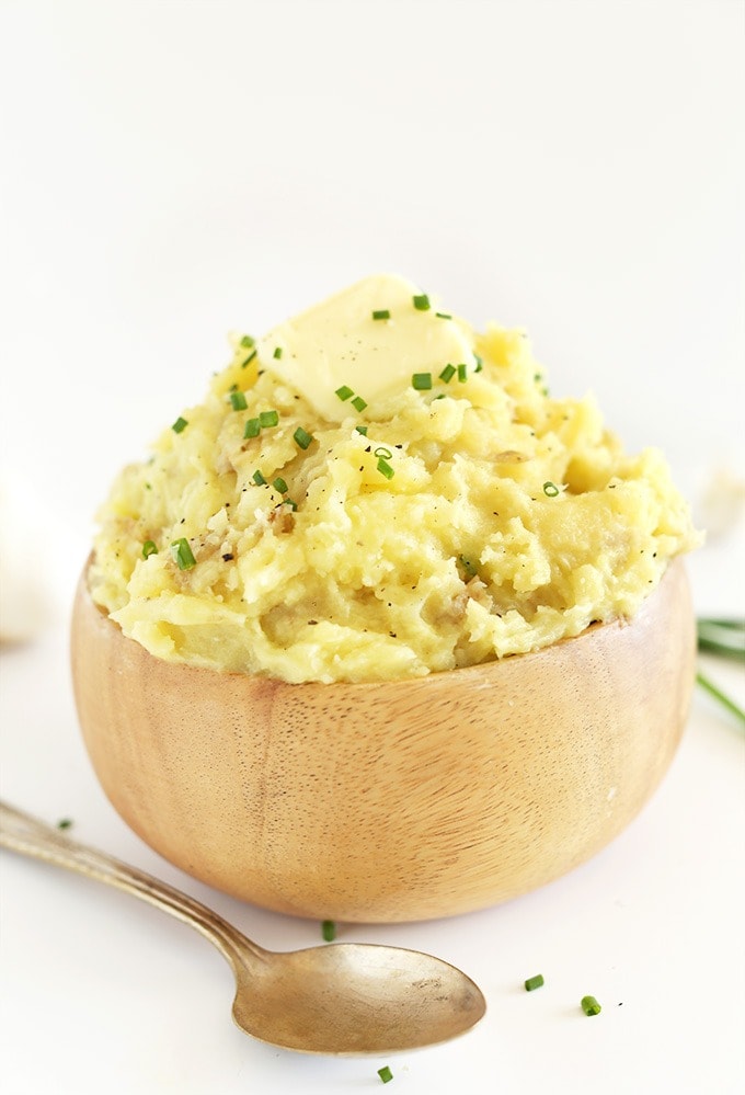 Mashed potatoes on a wooden bowl. 