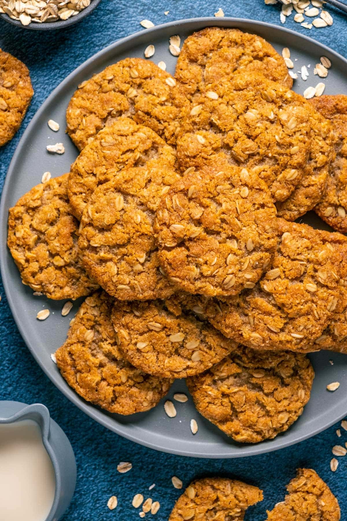 A bunch of oatmeal cookies on plate. 
