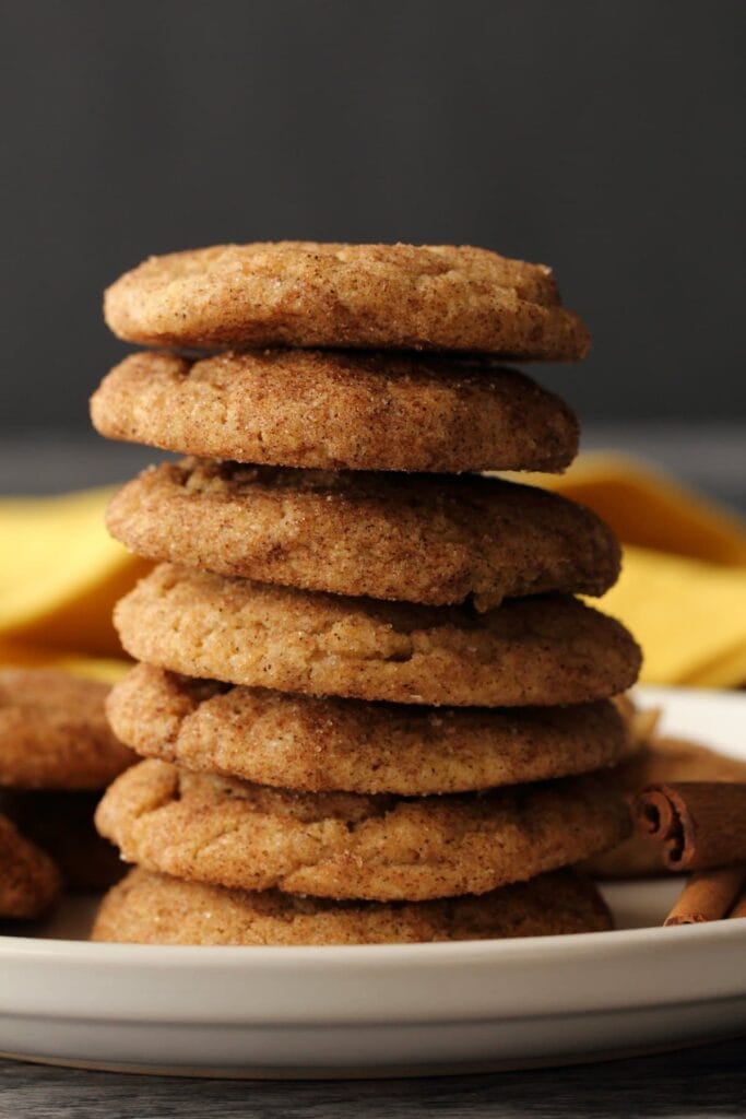 Snickerdoodle cookies stacked served on a plate.