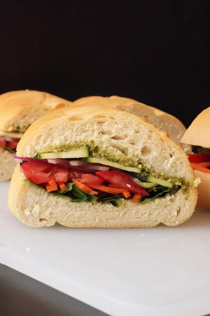 Sandwich with veggies filling and pesto dressing. 