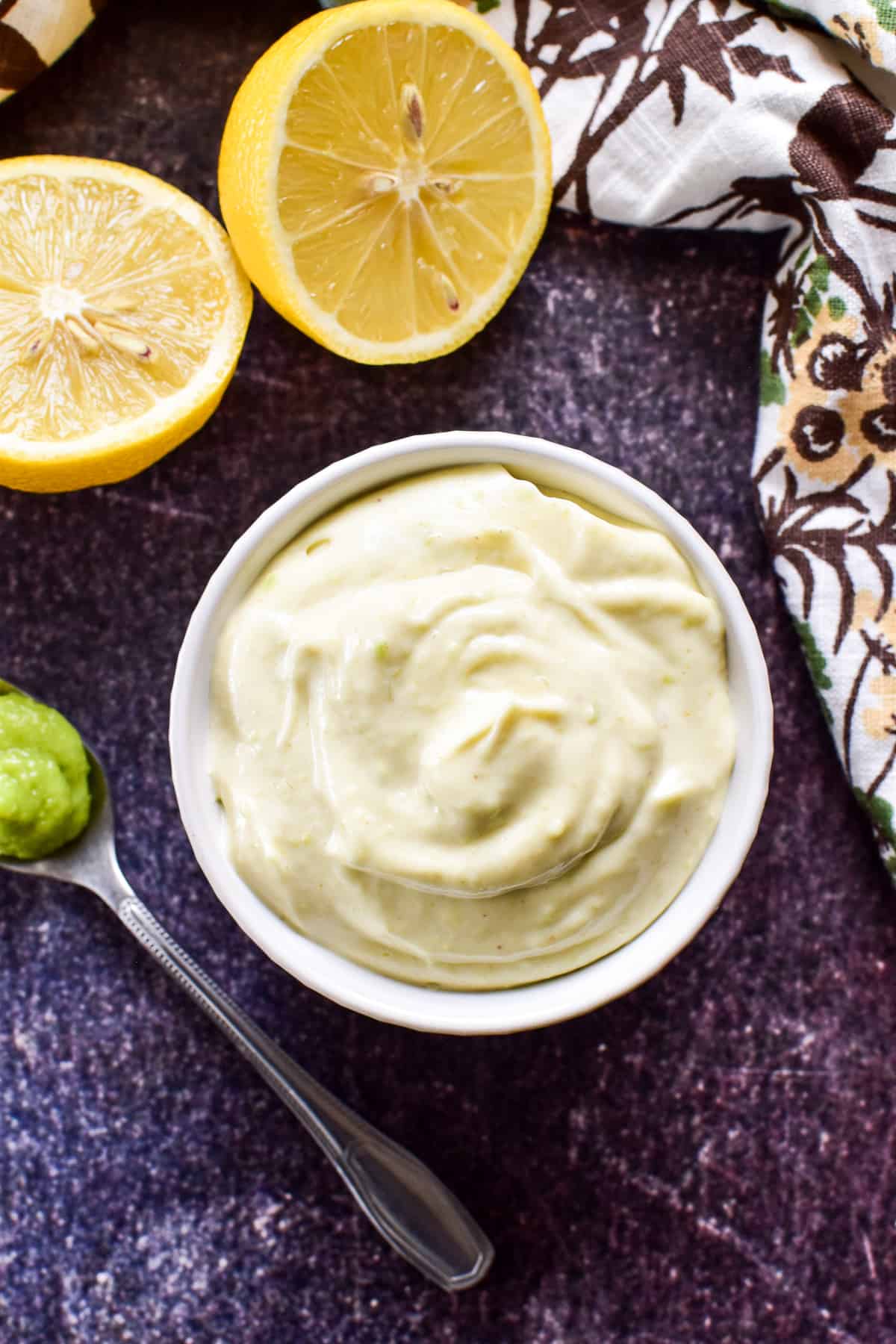 Creamy wasabi mayo with lemon in a small container