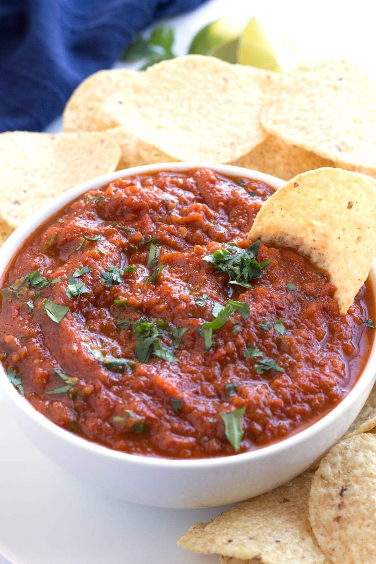 Homemade salsa sauce with herbs and tacos in a bowl