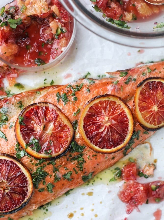Salmon brushed with herbal butter and topped with a winter citrus salsa.