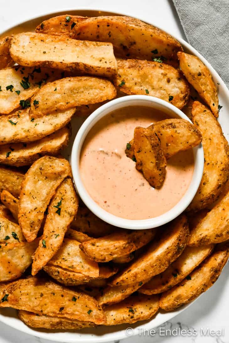 Bowl of chipotle mayo with fries
