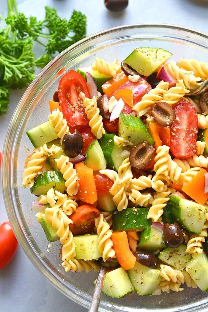 Pasta salad with zucchini, tomatoes and olives