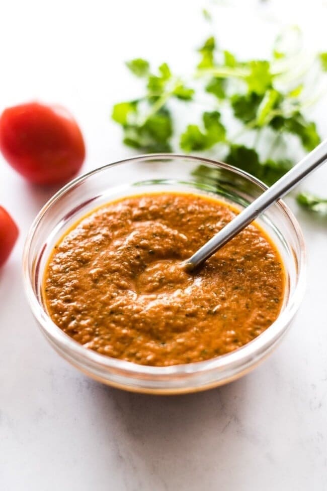Bowl of smoky homemade ranchero sauce packed with vegetable flavors