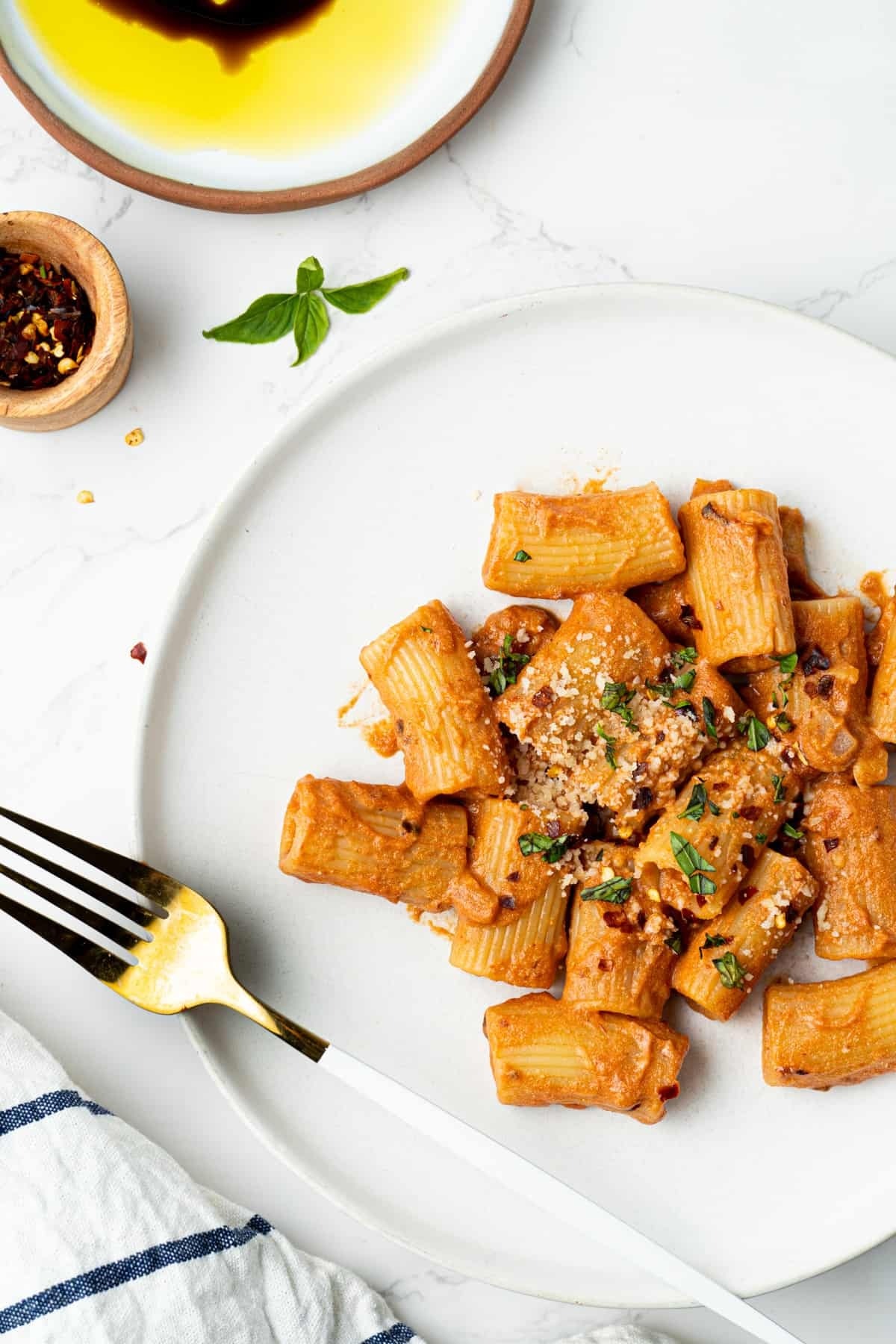 Spicy rigatoni pasta with tomato sauce on a plate 