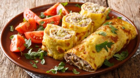 A plate of egg rolls tomatoes, a delicious and balanced meal