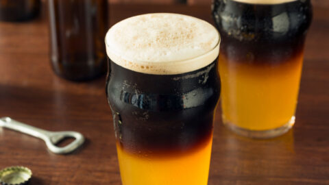Foamy half and half Irish cocktail on glasses.