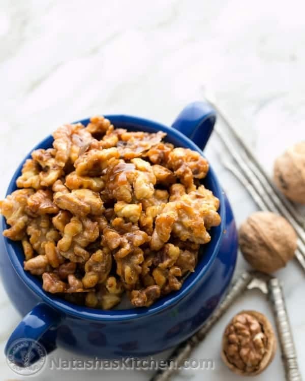 Blog mug filled with caramelized walnuts.