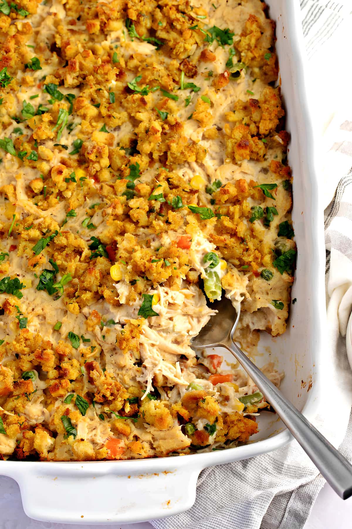 Stuffing casserole made with shredded chicken with veggies and cream on a dish. 