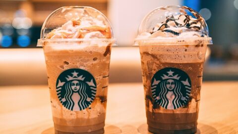 Chocolate Starbucks drinks on a wooden table.