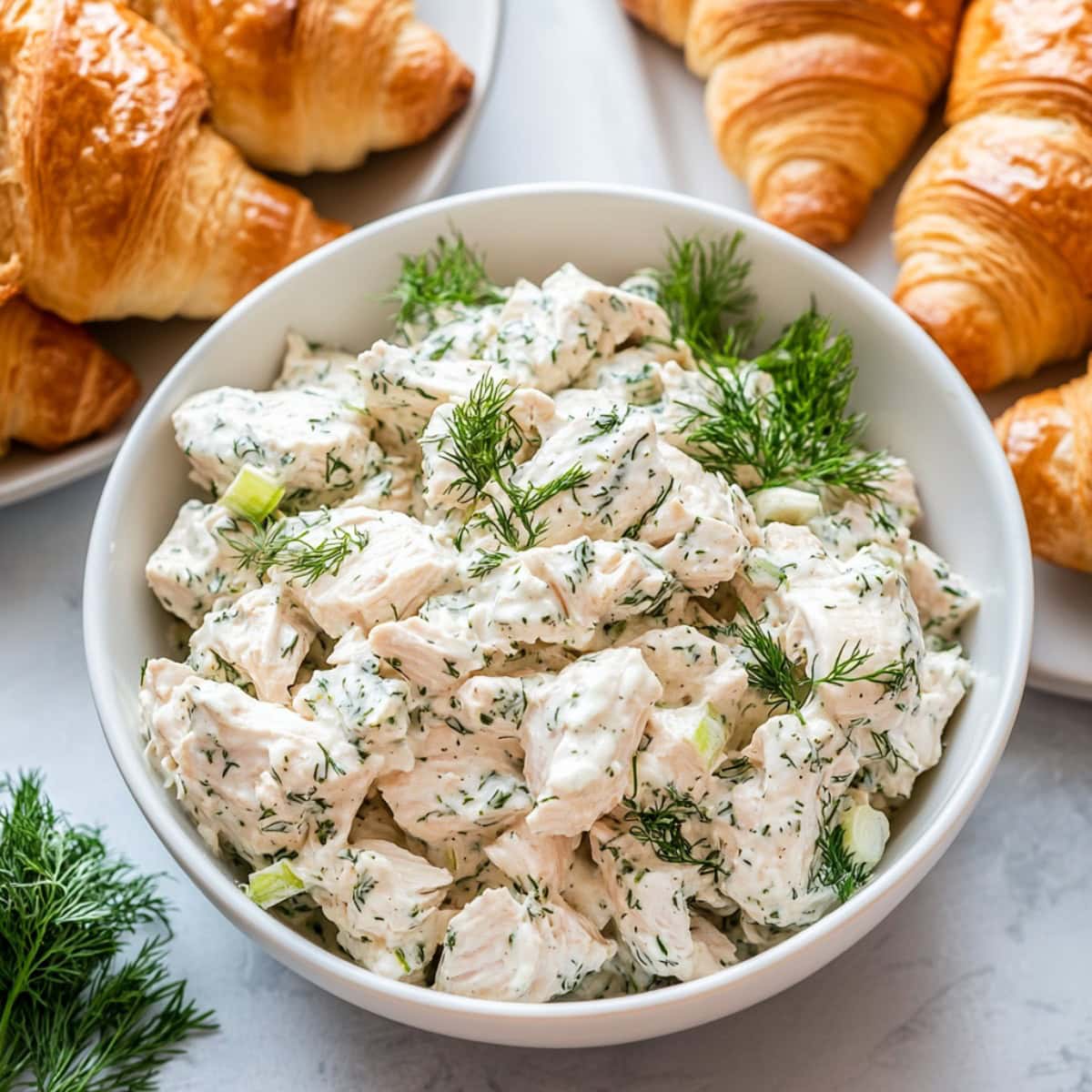 Creamy Dill Chicken Salad in a white bowl, top view