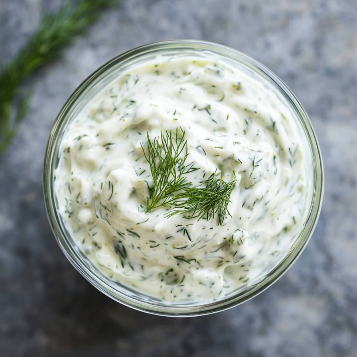 Creamy Dill Sauce in a glass bowl, top view