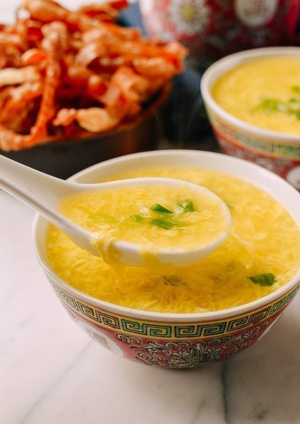Egg drop soup served on a Chinese bowl. 