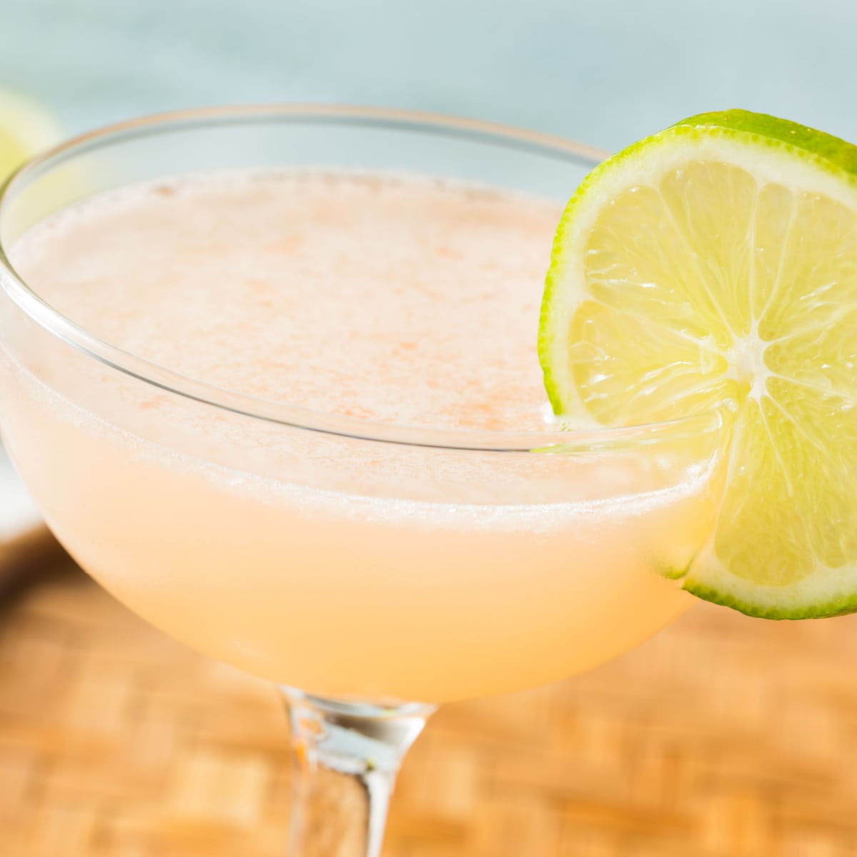 Sweet and tart Hemingway Daiquiri in a coupe glass with lime