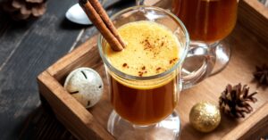 Hot Buttered Rum with Cinnamon in a Wooden Tray