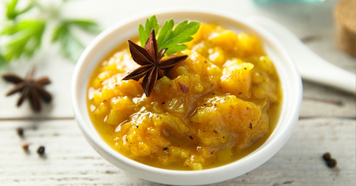 Traditional homemade mango chutney in a small container