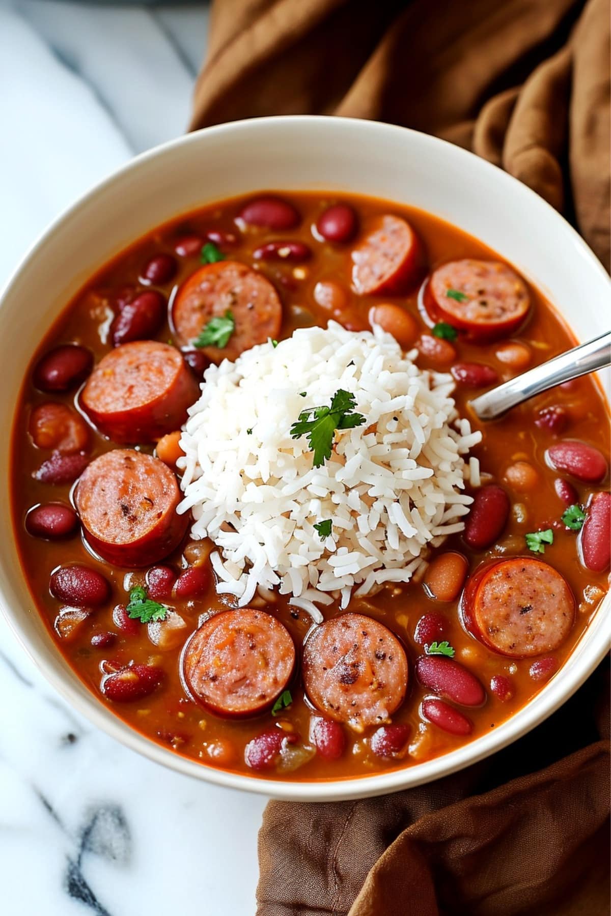 A delicious plate of red beans and rice with sausage, a flavorful and hearty dish