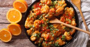 A pan filled with orange chicken, creating a delicious and vibrant dish