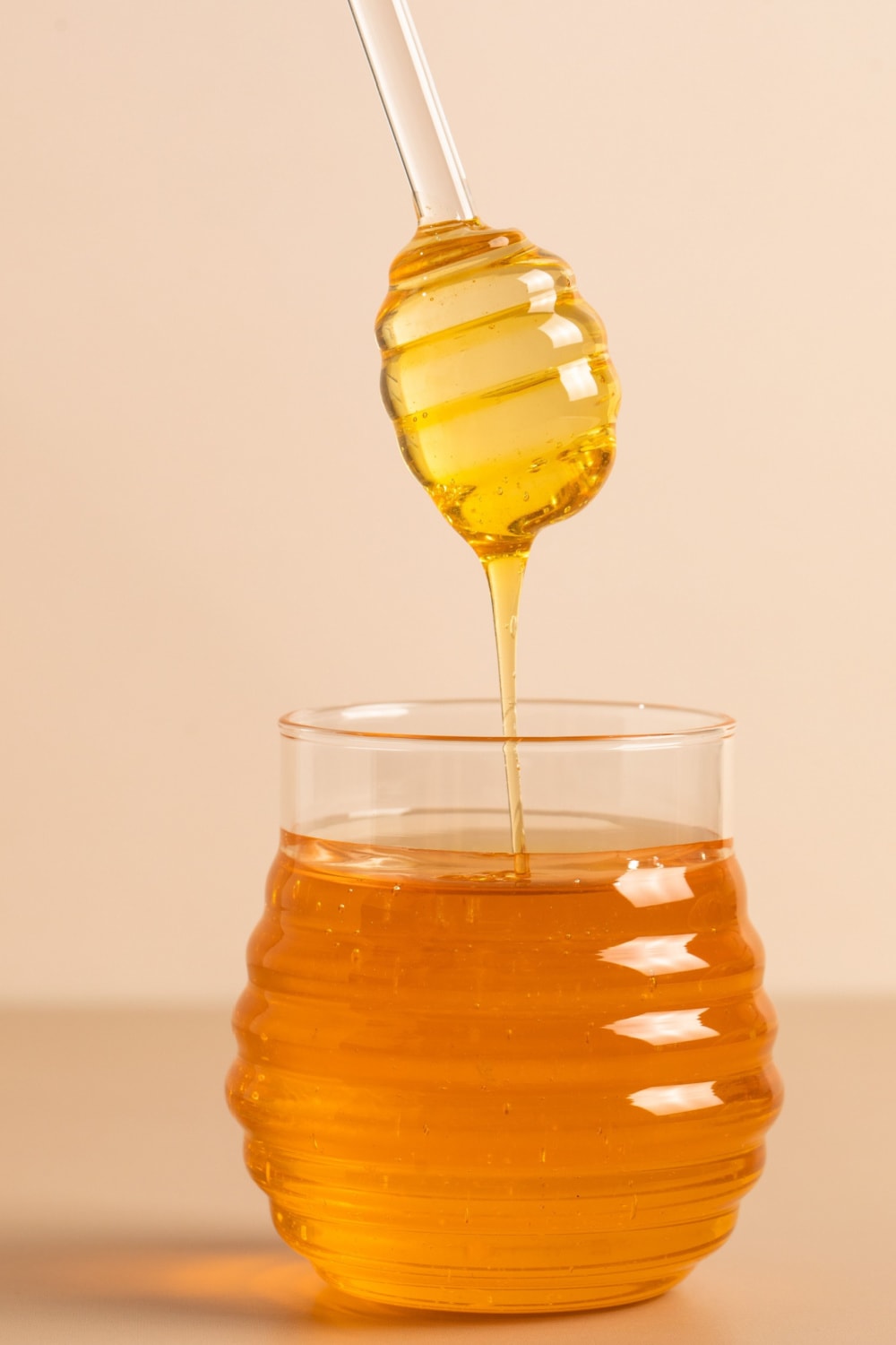Honey dripping from a bottle. 