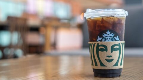 Iced coffee Starbucks on a wooden table.