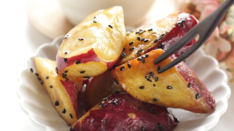 Savory homemade deep-fried and sugar coated Japanese sweet potatoes with black sesame seeds