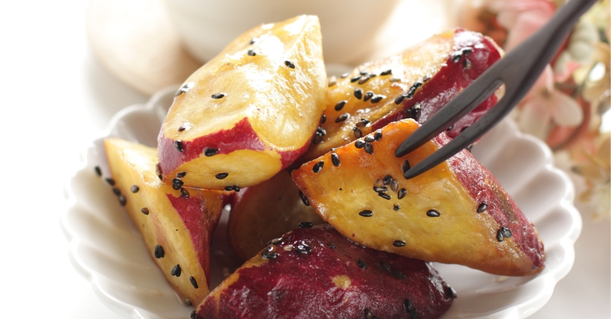 Savory homemade deep-fried and sugar coated Japanese sweet potatoes with black sesame seeds