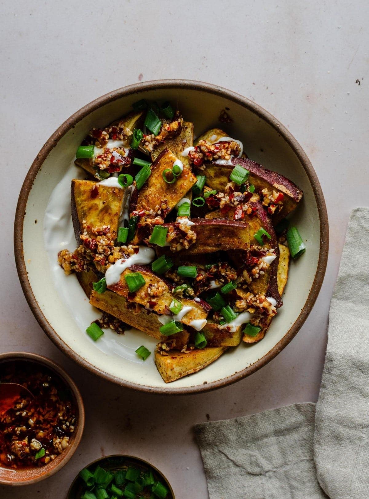 Sweet and spicy Japanese potatoes with chili crisp and yogurt in a bowl