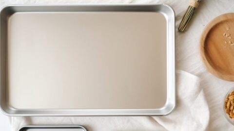 Empty jelly roll pan on a white table cloth.