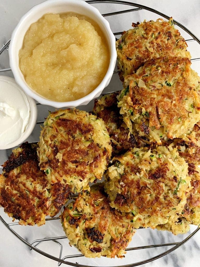 Appetizing homemade sweet potato and zucchini latkes with dipping sauce