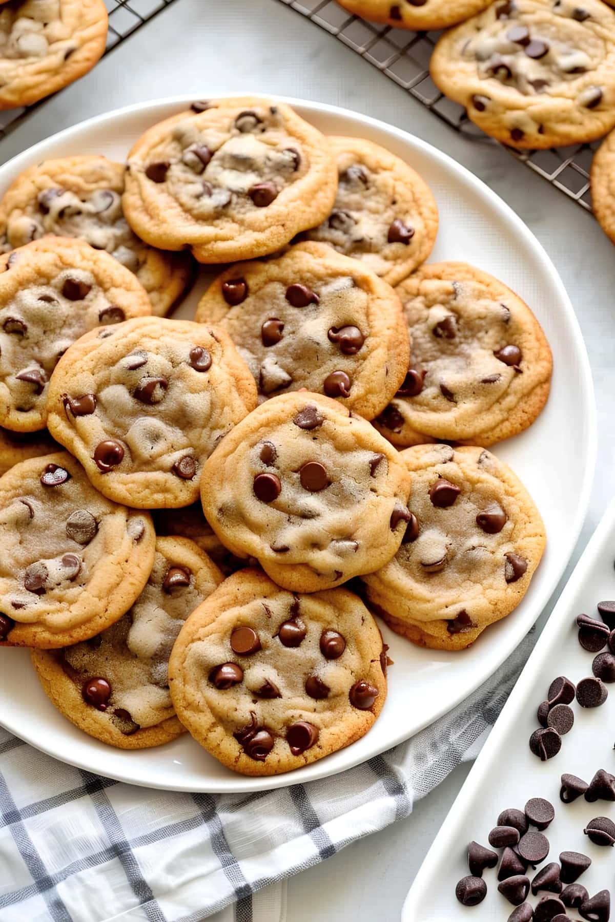 Homemade sweet and chewy chocolate chip cookies in a white plate