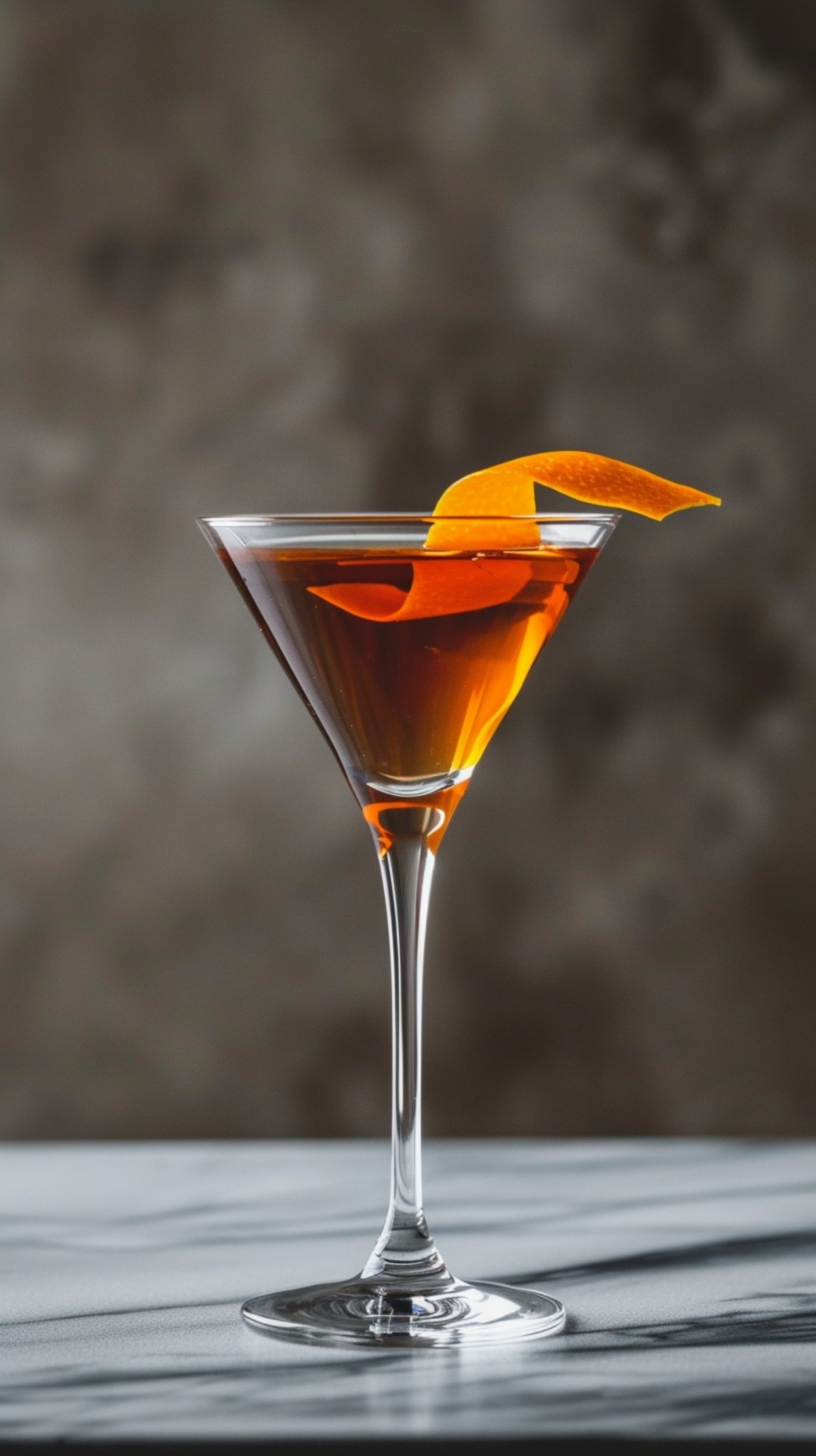 Toronto cocktail with an orange twist in a martini glass