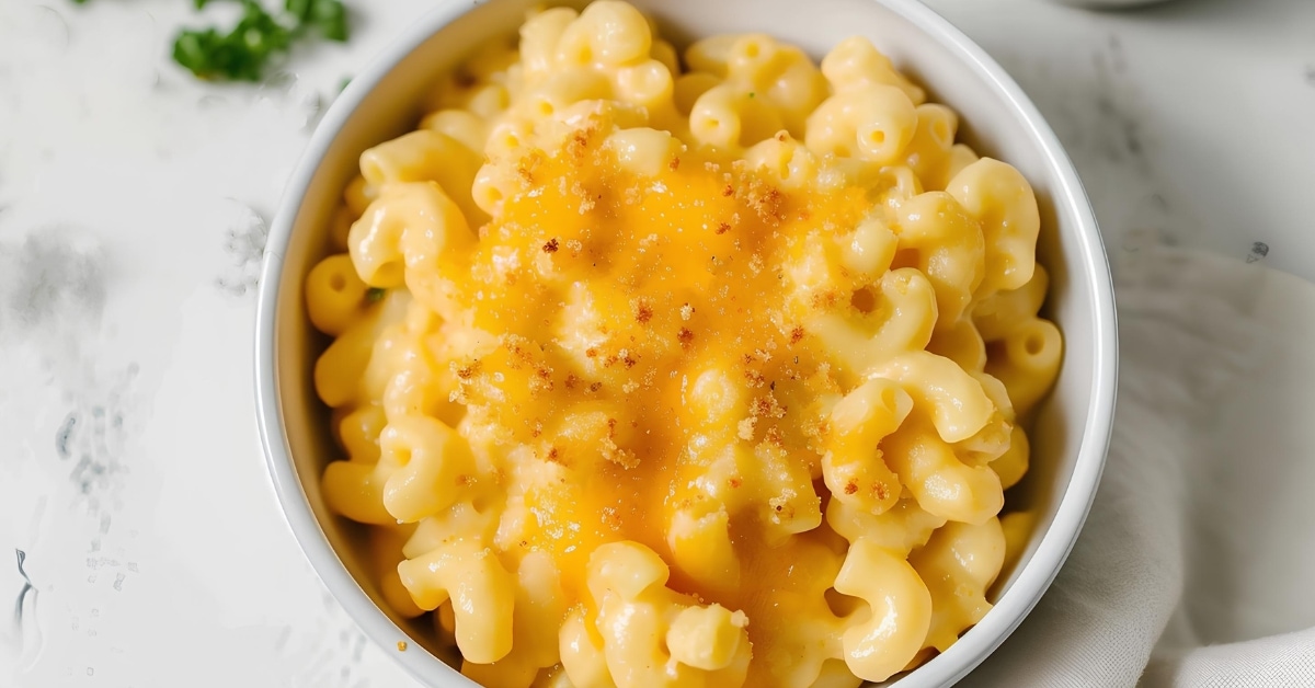 A white bowl filled with homemade mac and cheese