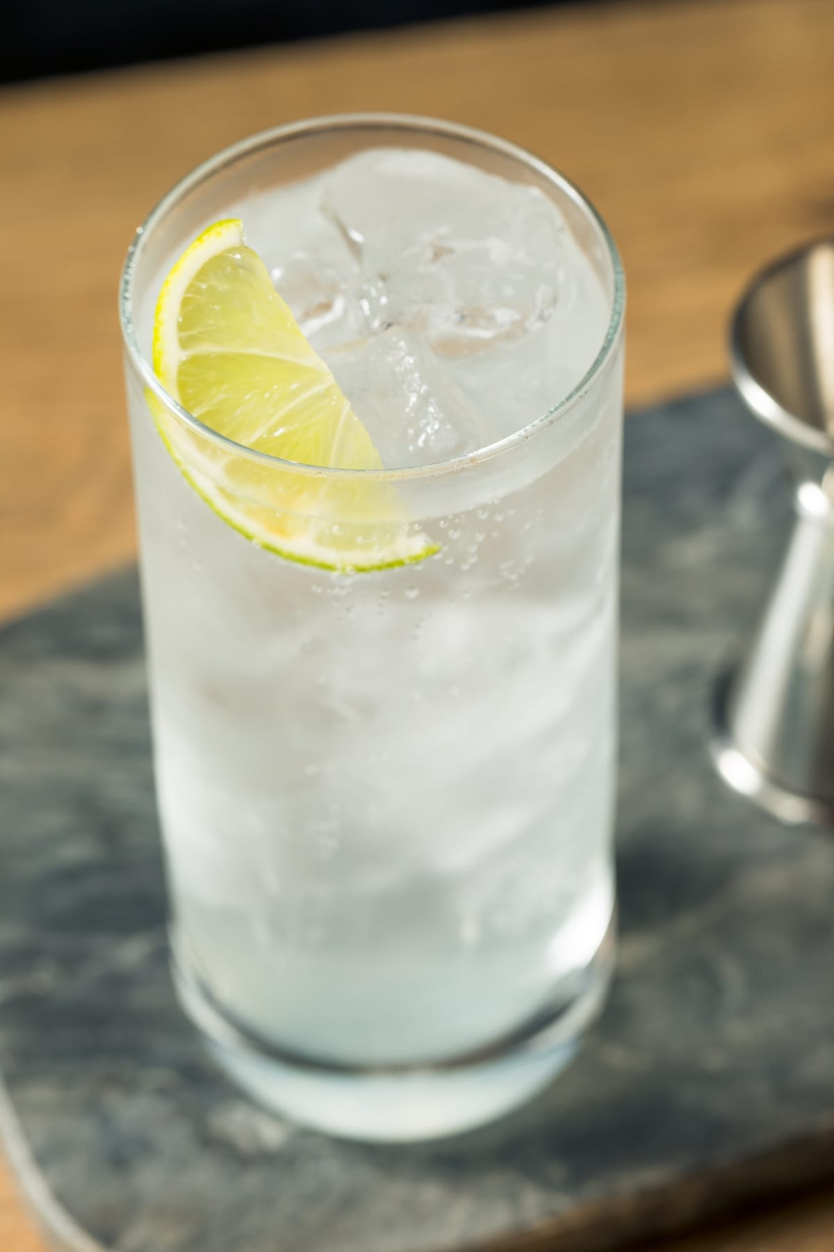 Angled view of Ranch water cocktail on a highball glass filled with ice. 