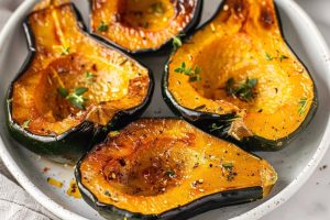 Acorn squash air fried served in a white plate.